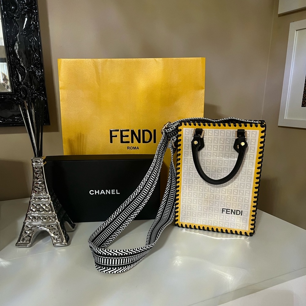 Designer shopping bag upcycled into a handbag.